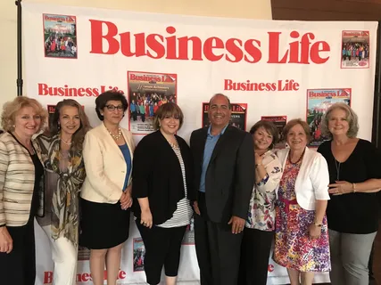 Melina Sardar with colleagues at a business community event
