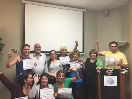 Melina Sardar celebrating with a workshop group